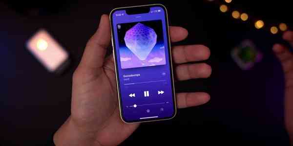 The-Rewind-iPhone-13-mini-in-hand