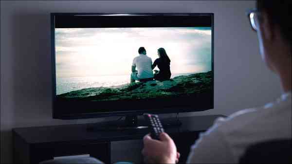 man-pointing-remote-tv
