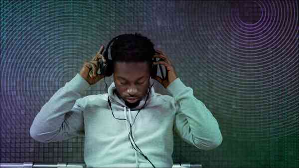 man-wearing-headphones-textured-background