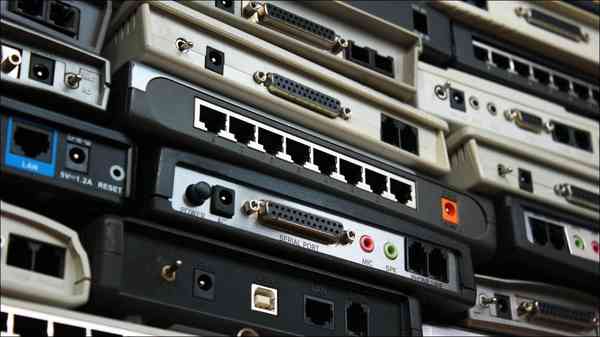 wall-of-old-network-routers