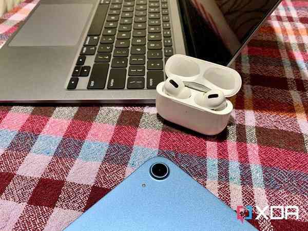 AirPods-Pro-open-case-next-to-MacBook-Air-M1-and-iPad-Air-5-Large-1024x768-1